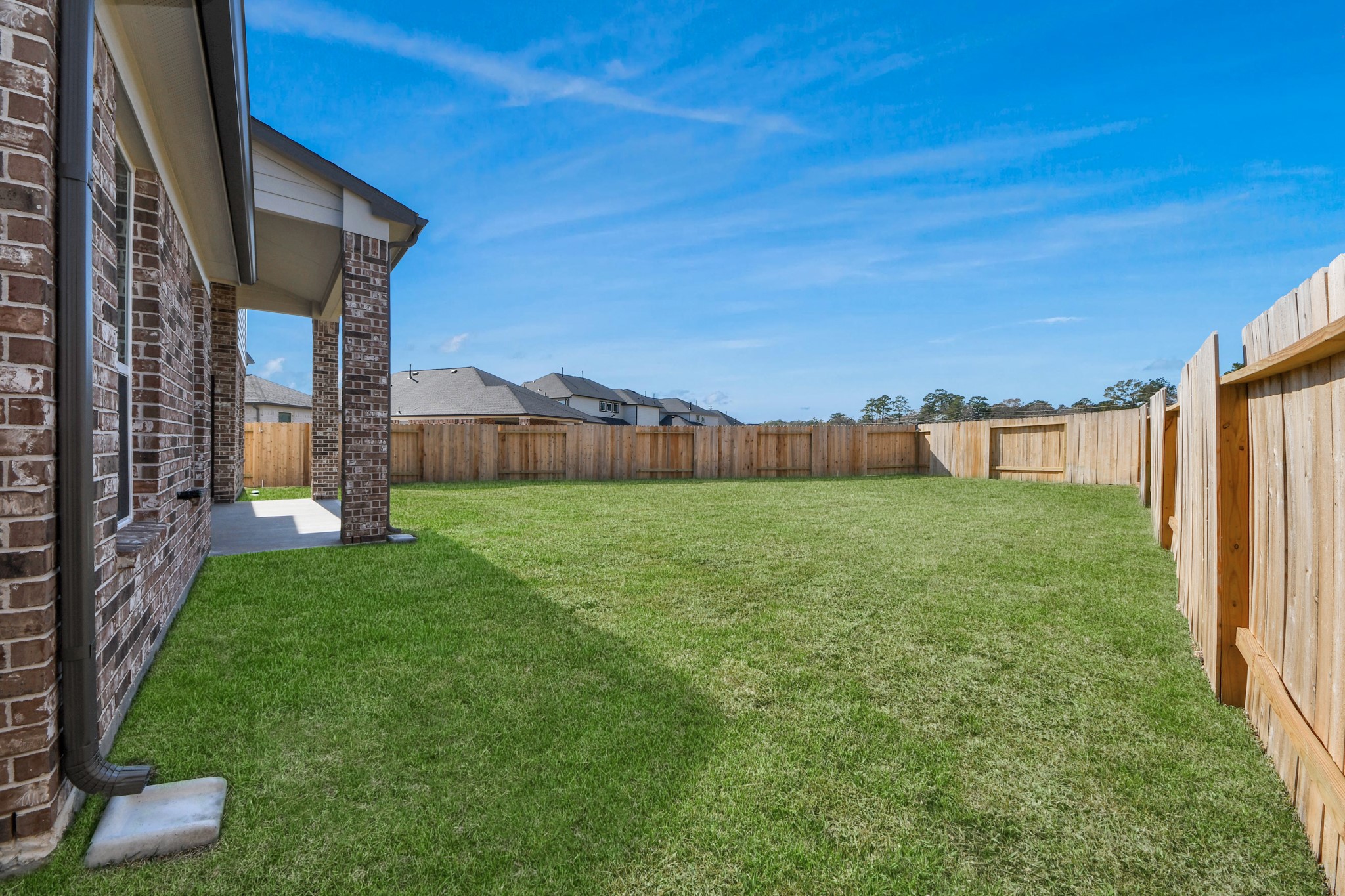3109 North Spring Drive Spring, TX 77373 - Photo 46 of 50 Backyard retreat, offering an abundance of space for kids to play and explore. The possibilities are endless in this outdoor haven, where the joy of open-air activities and family gatherings awaits.