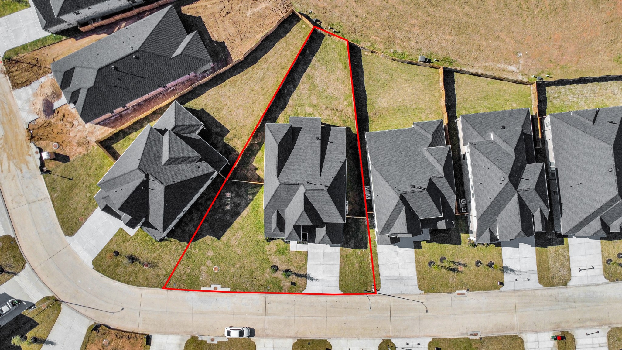 3109 North Spring Drive Spring, TX 77373 - Photo 5 of 50 An aerial view of a spacious subdivision lot, highlighting a well-maintained yard and a fully fenced perimeter, offering both privacy and expansive outdoor space.