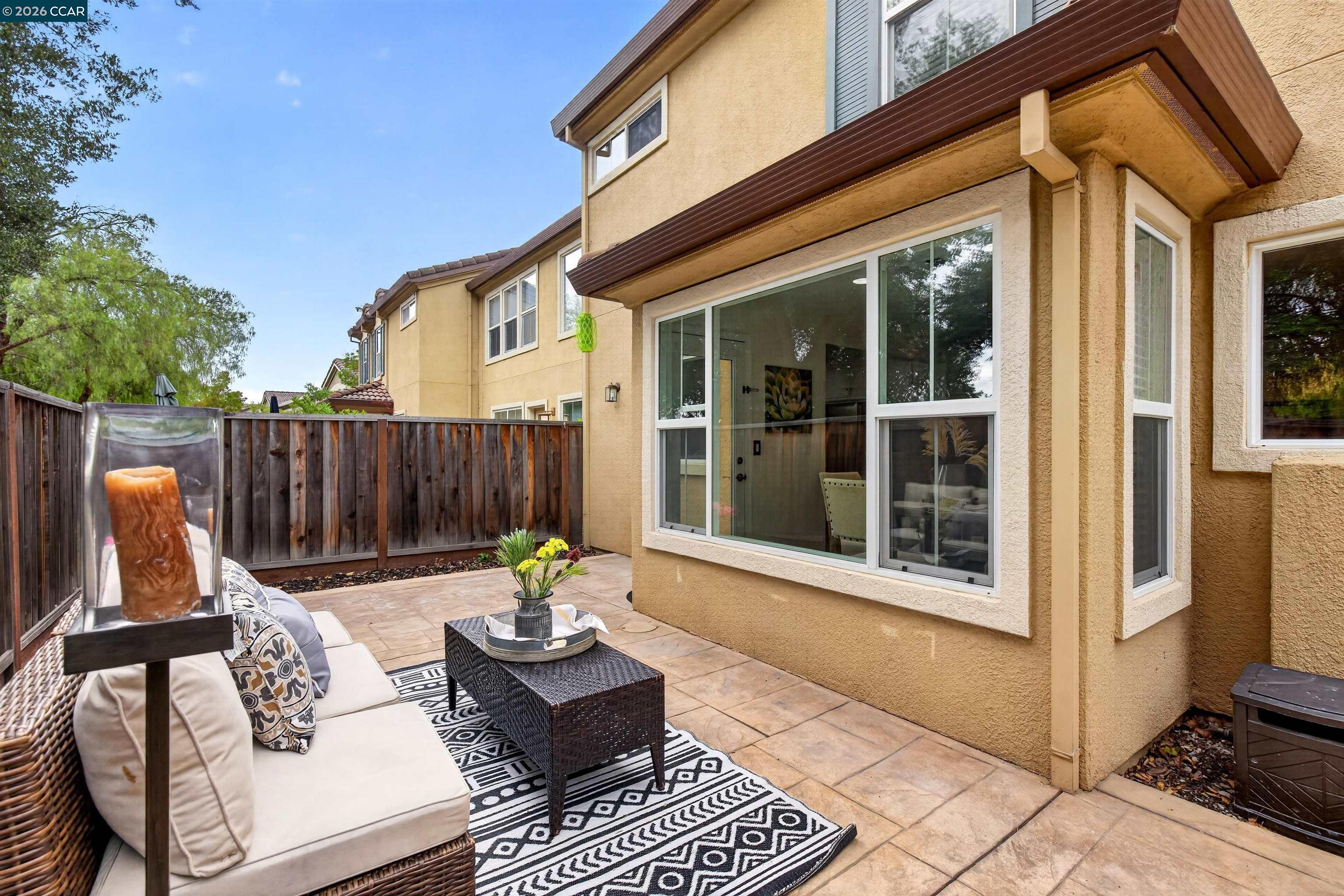 124 Coralflower Lane San Ramon, CA 94582 - Photo 27 of 47 a view of a patio with a table and chairs