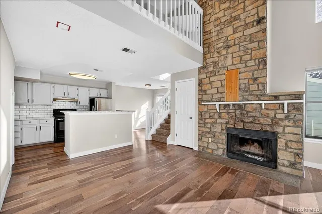 a view of a kitchen with furniture and a fireplace