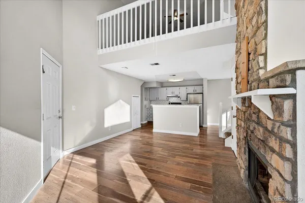 a view of a hallway with a kitchen