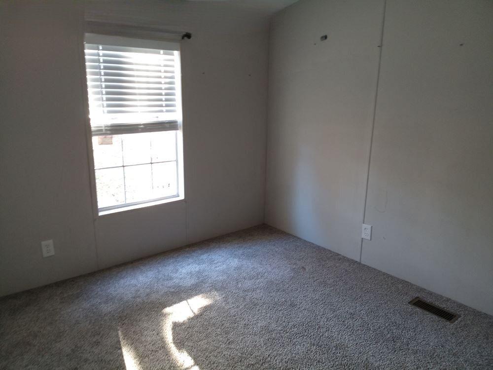 265 Perry Lane Buchanan, GA 30113 - Photo 18 of 20 an empty room with a window