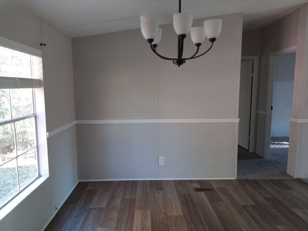 265 Perry Lane Buchanan, GA 30113 - Photo 19 of 20 wooden floor in an empty room with a window