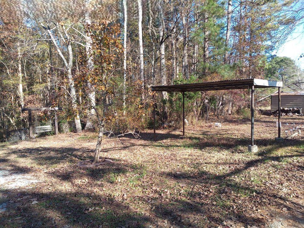 265 Perry Lane Buchanan, GA 30113 - Photo 10 of 20 a view of a yard with wooden fence