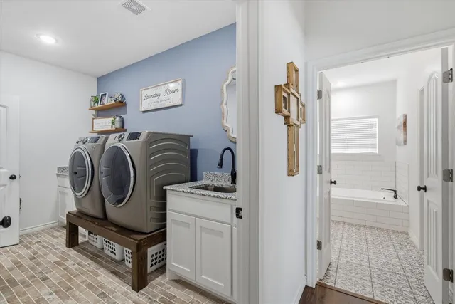a utility room with dryer and washer