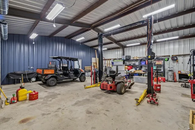 a view of a garage with a bike and wooden roof