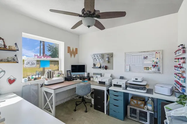 a view of a workspace with furniture and toys