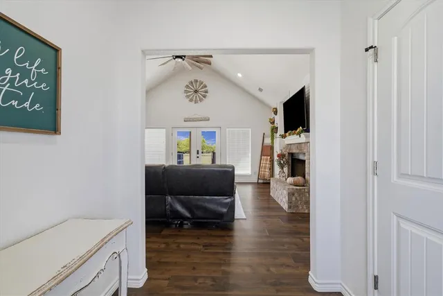 a living room with furniture and flowers