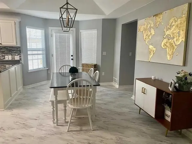 a view of a dining room with furniture window and outside view