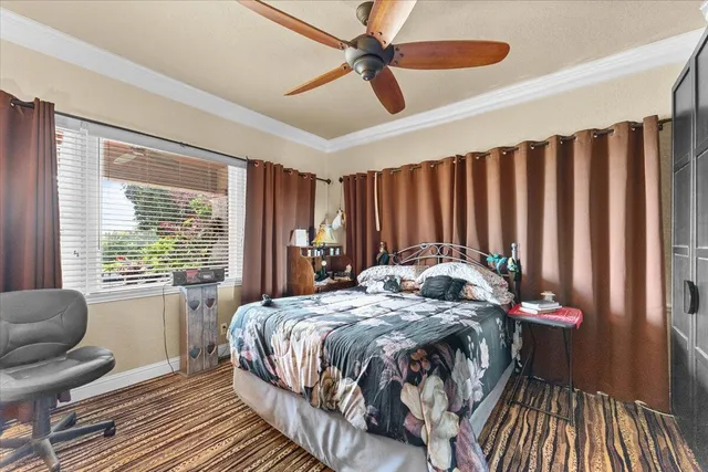 a bathroom with a shower curtain and a large window