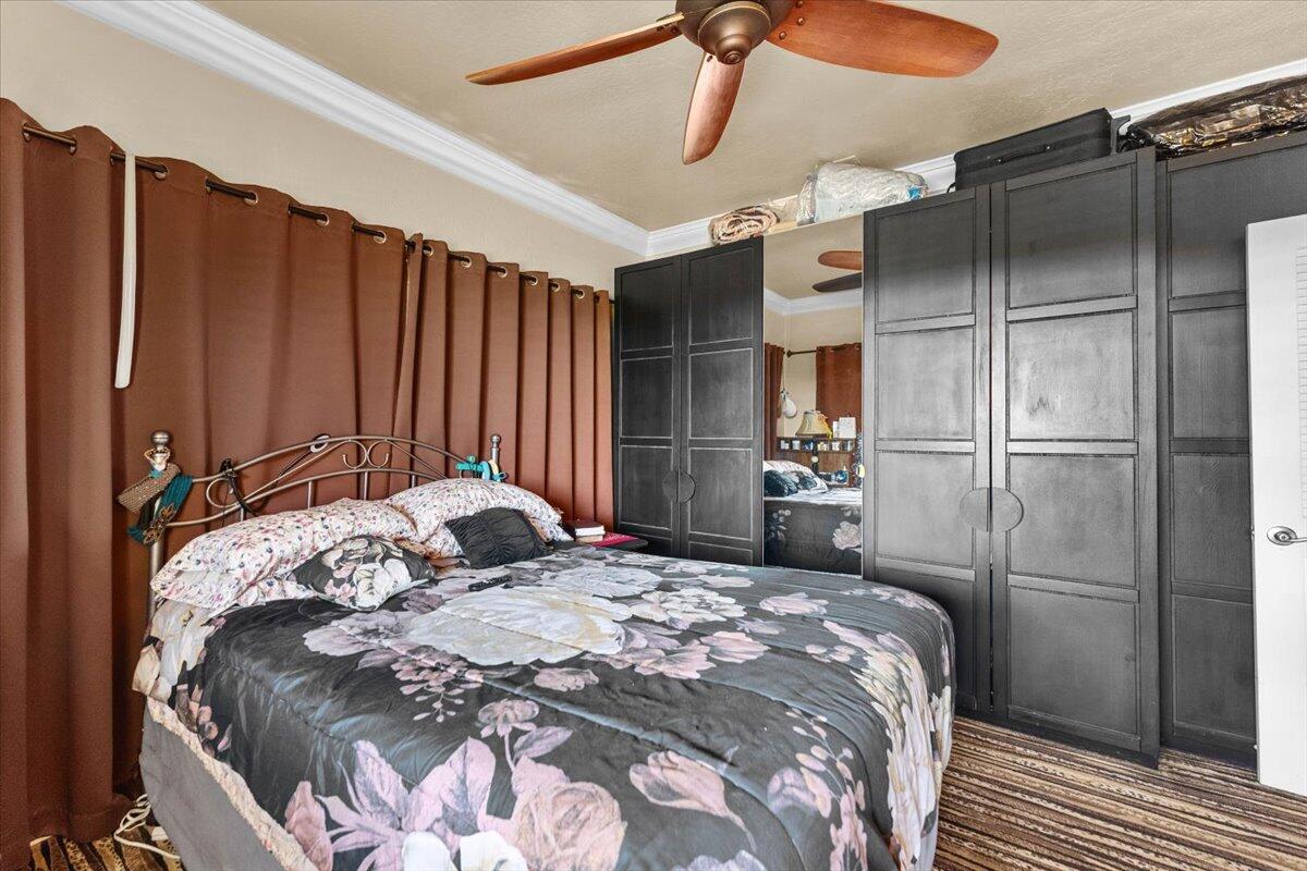 931 Rio Street Red Bluff, CA 96080 - Photo 19 of 54 a bedroom with a bed and a walk in closet