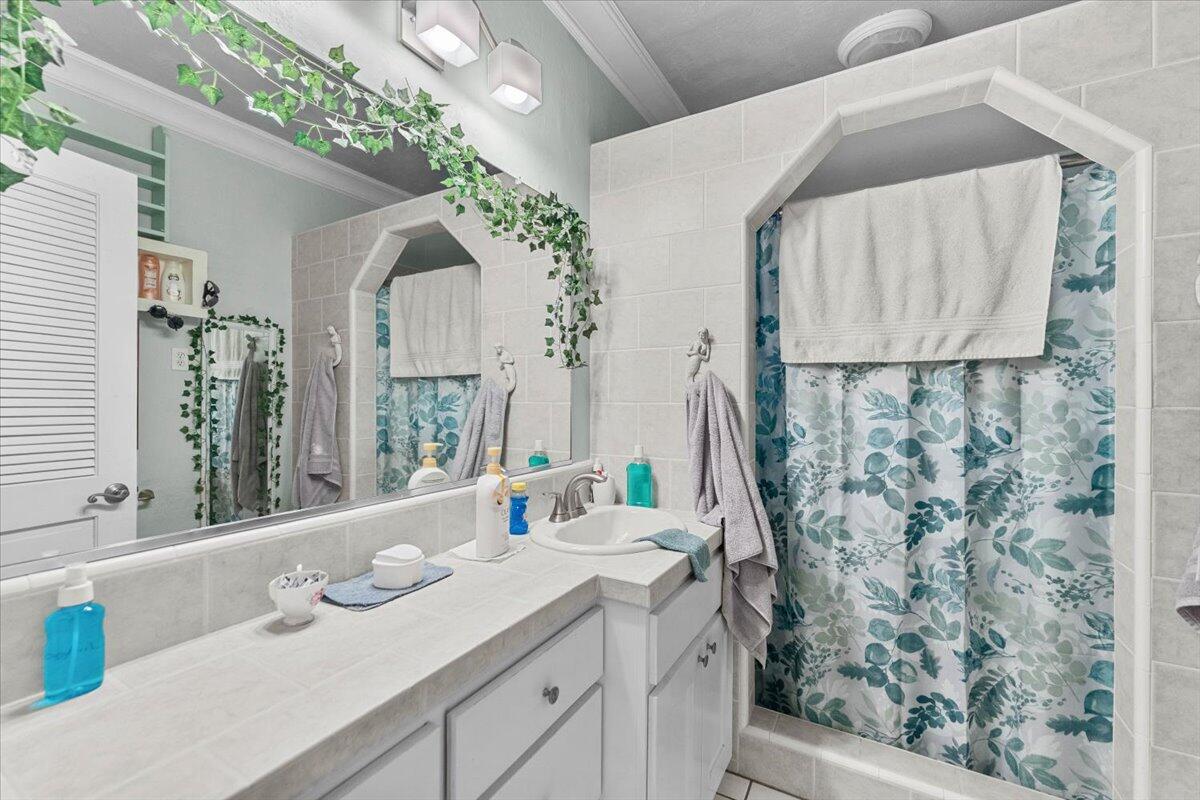 931 Rio Street Red Bluff, CA 96080 - Photo 20 of 54 a bathroom with a sink and a mirror
