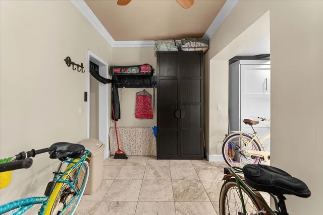 a bedroom with furniture and a window