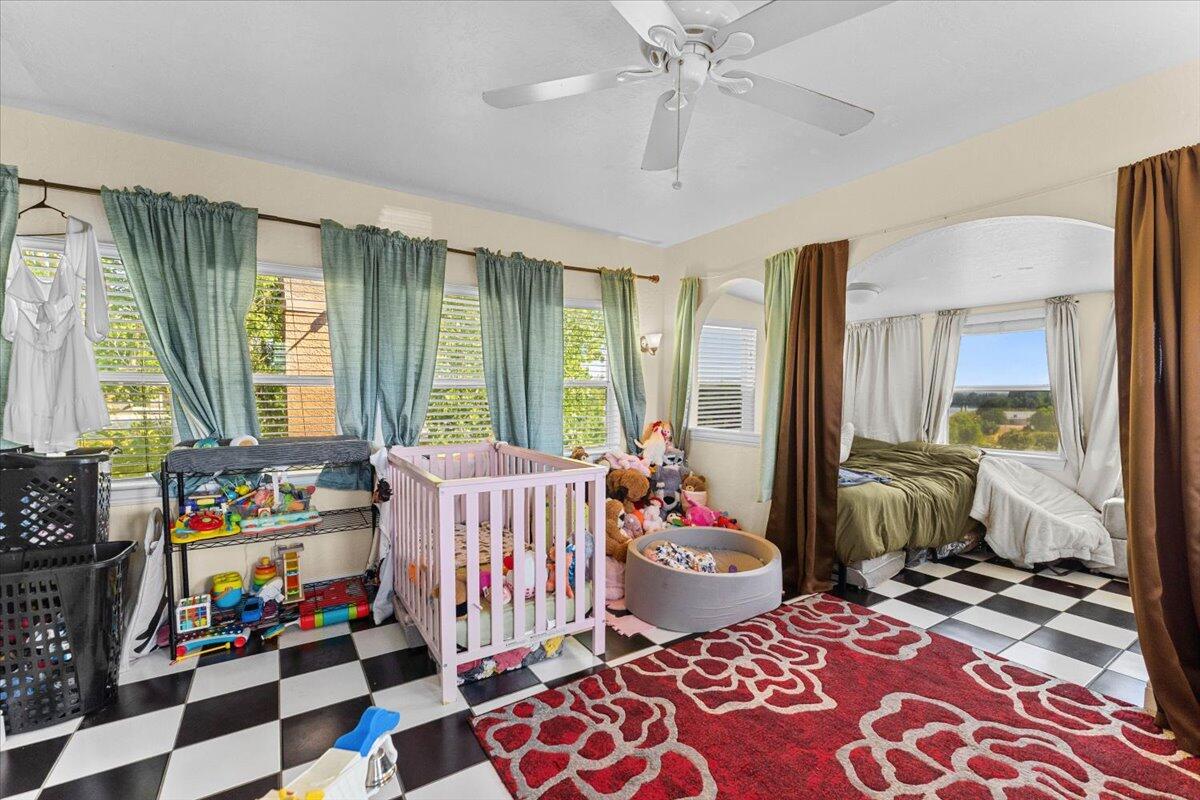 931 Rio Street Red Bluff, CA 96080 - Photo 27 of 54 a bedroom with furniture and a window