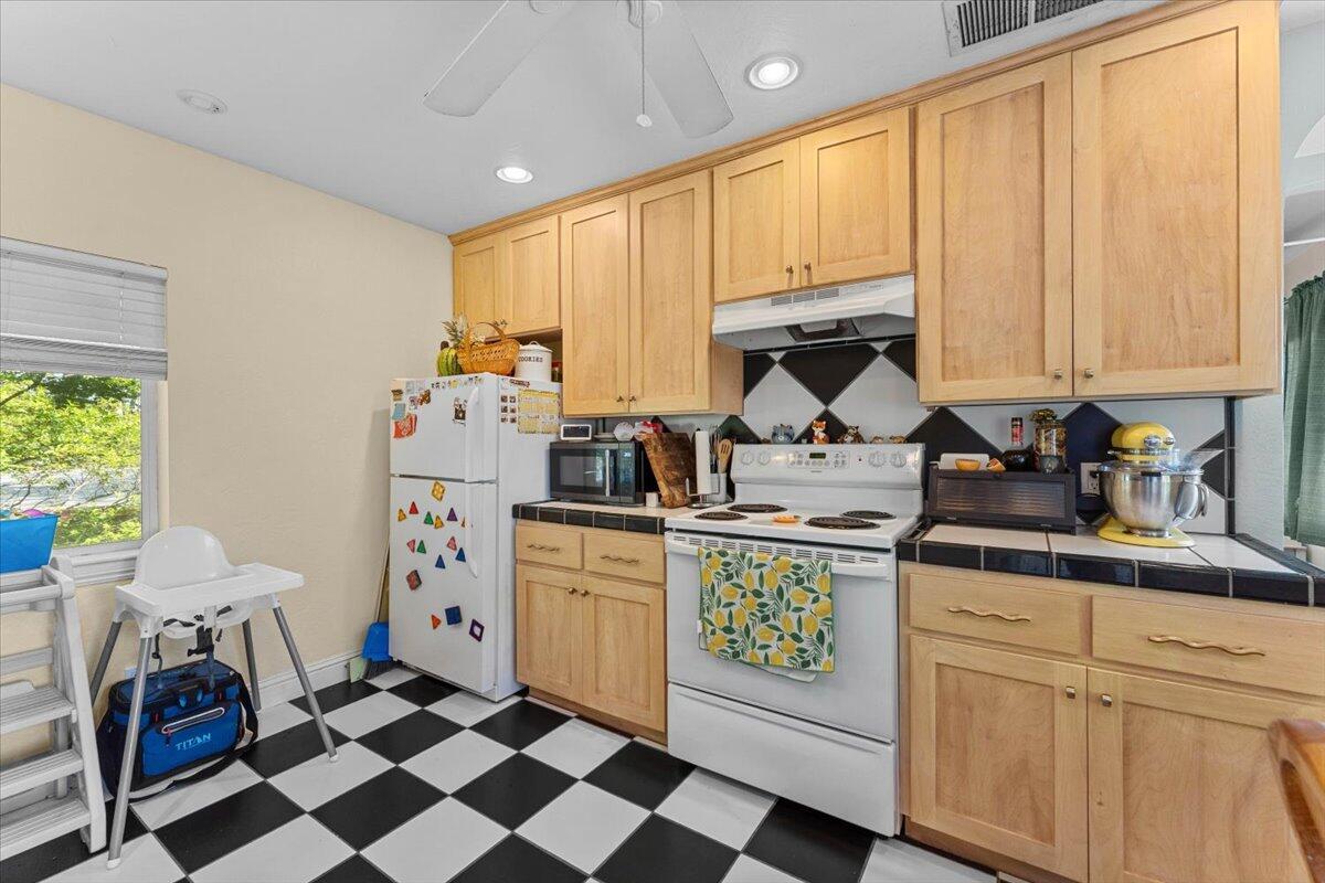 931 Rio Street Red Bluff, CA 96080 - Photo 28 of 54 a kitchen with stainless steel appliances a stove a sink and a refrigerator