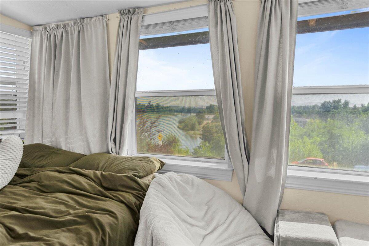 931 Rio Street Red Bluff, CA 96080 - Photo 32 of 54 a bed sitting in a bedroom next to a window