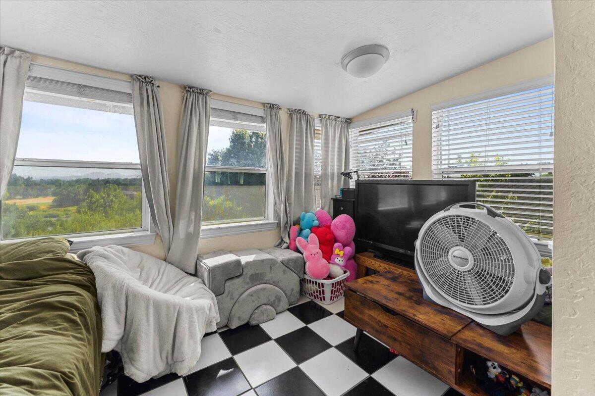 931 Rio Street Red Bluff, CA 96080 - Photo 33 of 54 a living room with furniture and a floor to ceiling window
