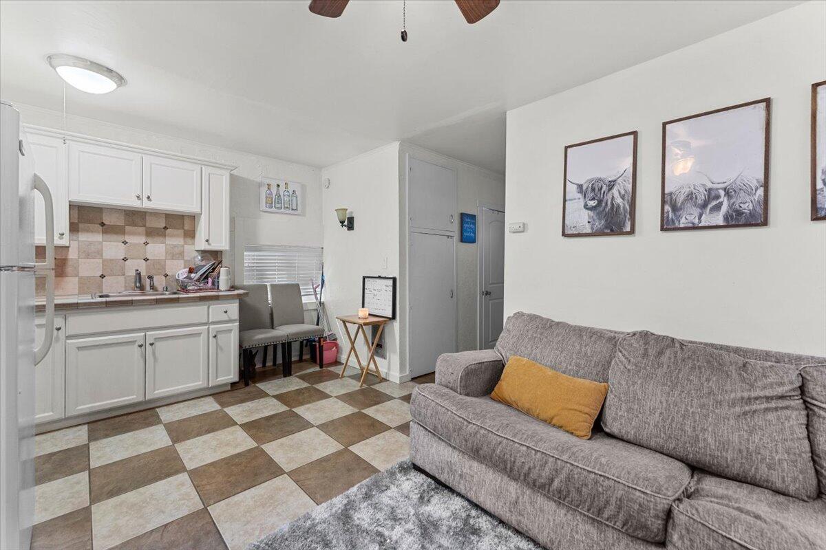 931 Rio Street Red Bluff, CA 96080 - Photo 39 of 54 a living room with a couch and a dresser next to a window