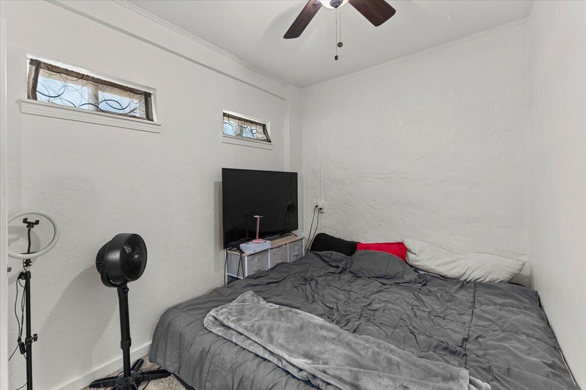 931 Rio Street Red Bluff, CA 96080 - Photo 41 of 54 a bedroom with a bed and a flat screen tv