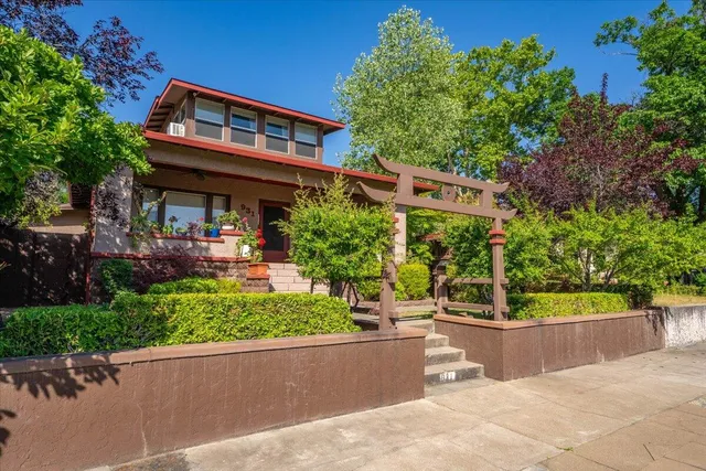 a building outdoor space with patio furniture and potted plants