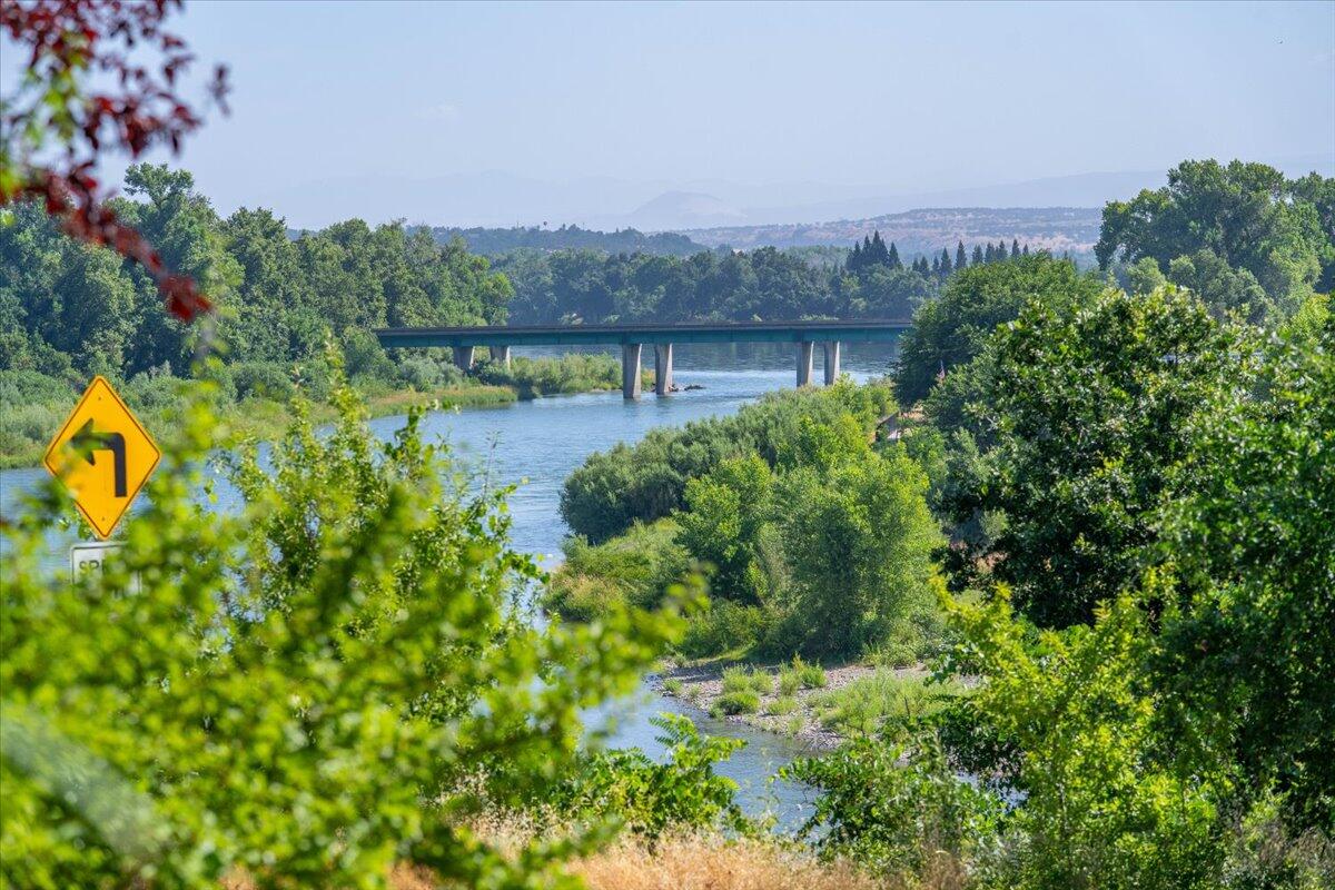 931 Rio Street Red Bluff, CA 96080 - Photo 10 of 54 a view of a house with a yard and a large tree center