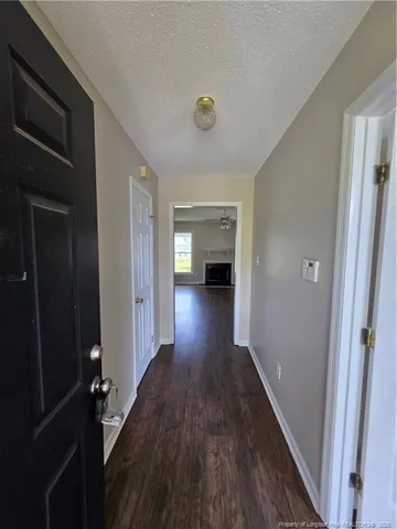 a view of gallery with wooden floor