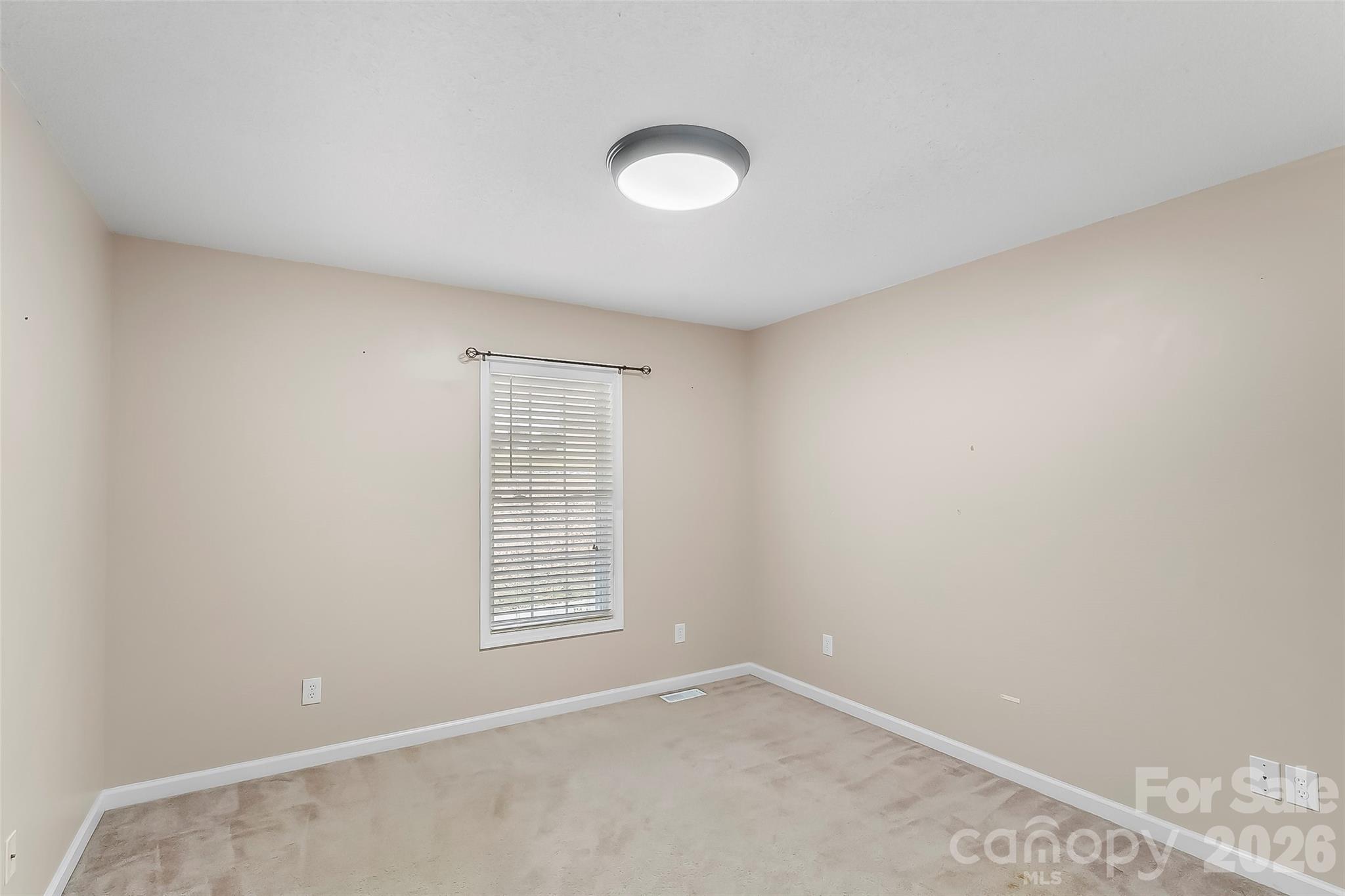 1926 Timber Trace Morganton, NC 28655 - Photo 11 of 36 an empty room with windows