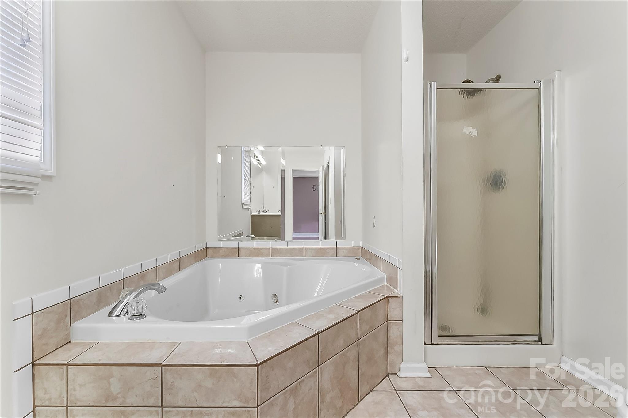 1926 Timber Trace Morganton, NC 28655 - Photo 16 of 36 a bathroom with a bathtub and shower