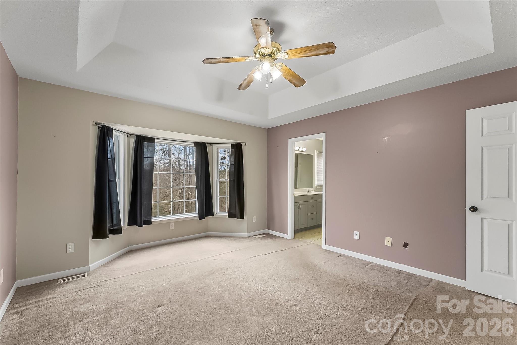 1926 Timber Trace Morganton, NC 28655 - Photo 18 of 36 a view of a livingroom with a ceiling fan and window
