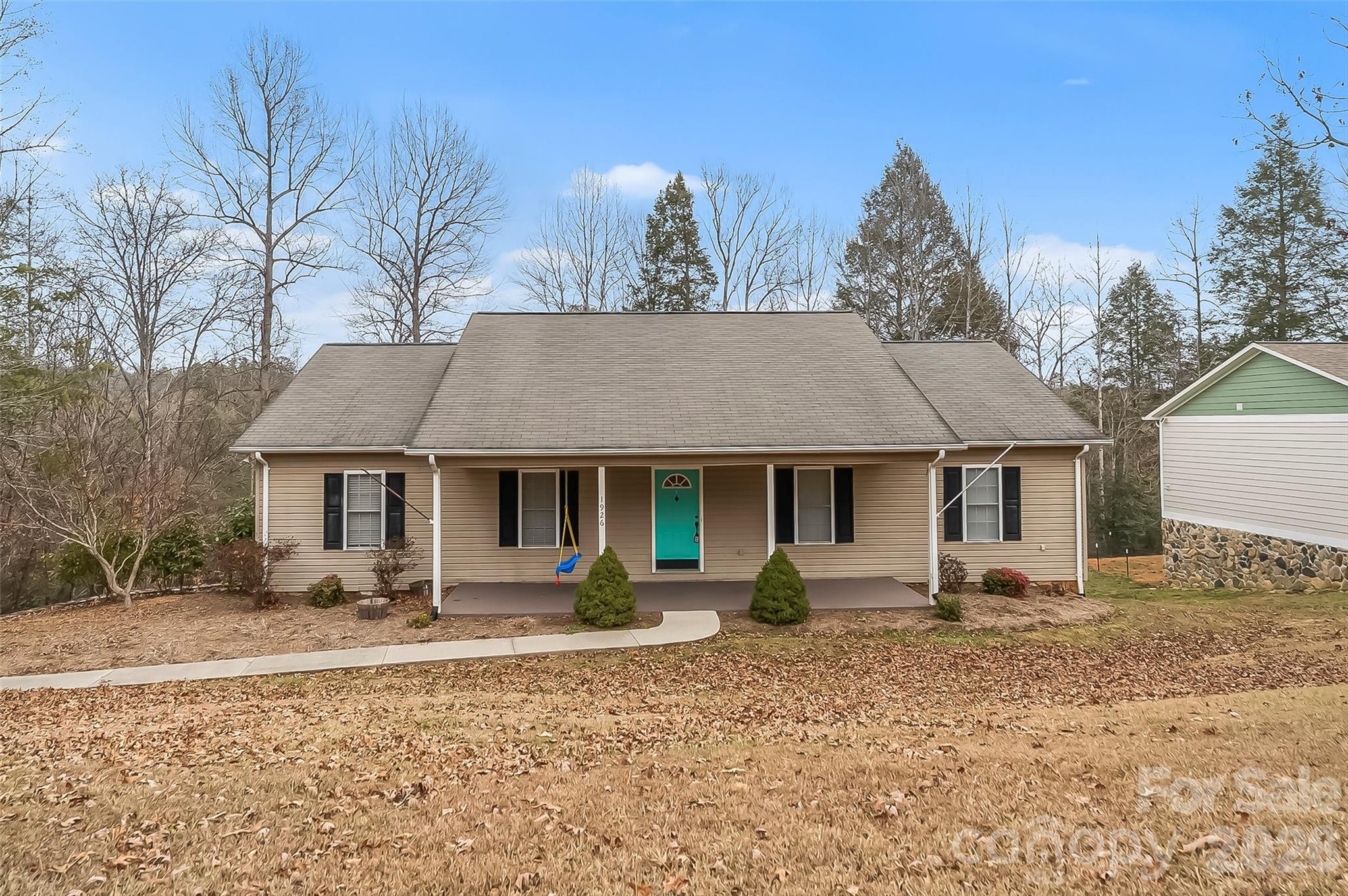 1926 Timber Trace Morganton, NC 28655 - Photo 2 of 36 a front view of a house with garden