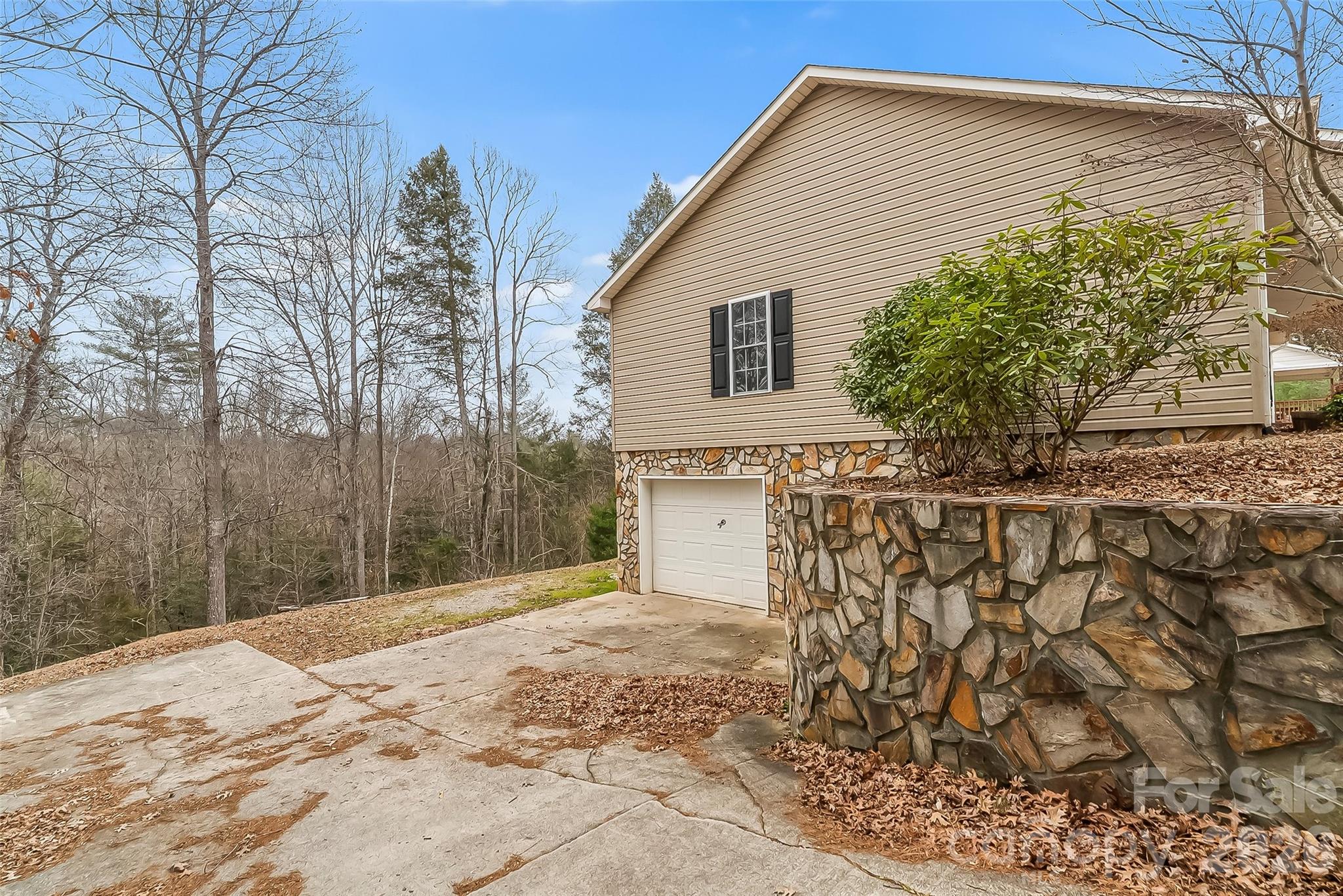 1926 Timber Trace Morganton, NC 28655 - Photo 28 of 36 a view of a house with a snow in the yard