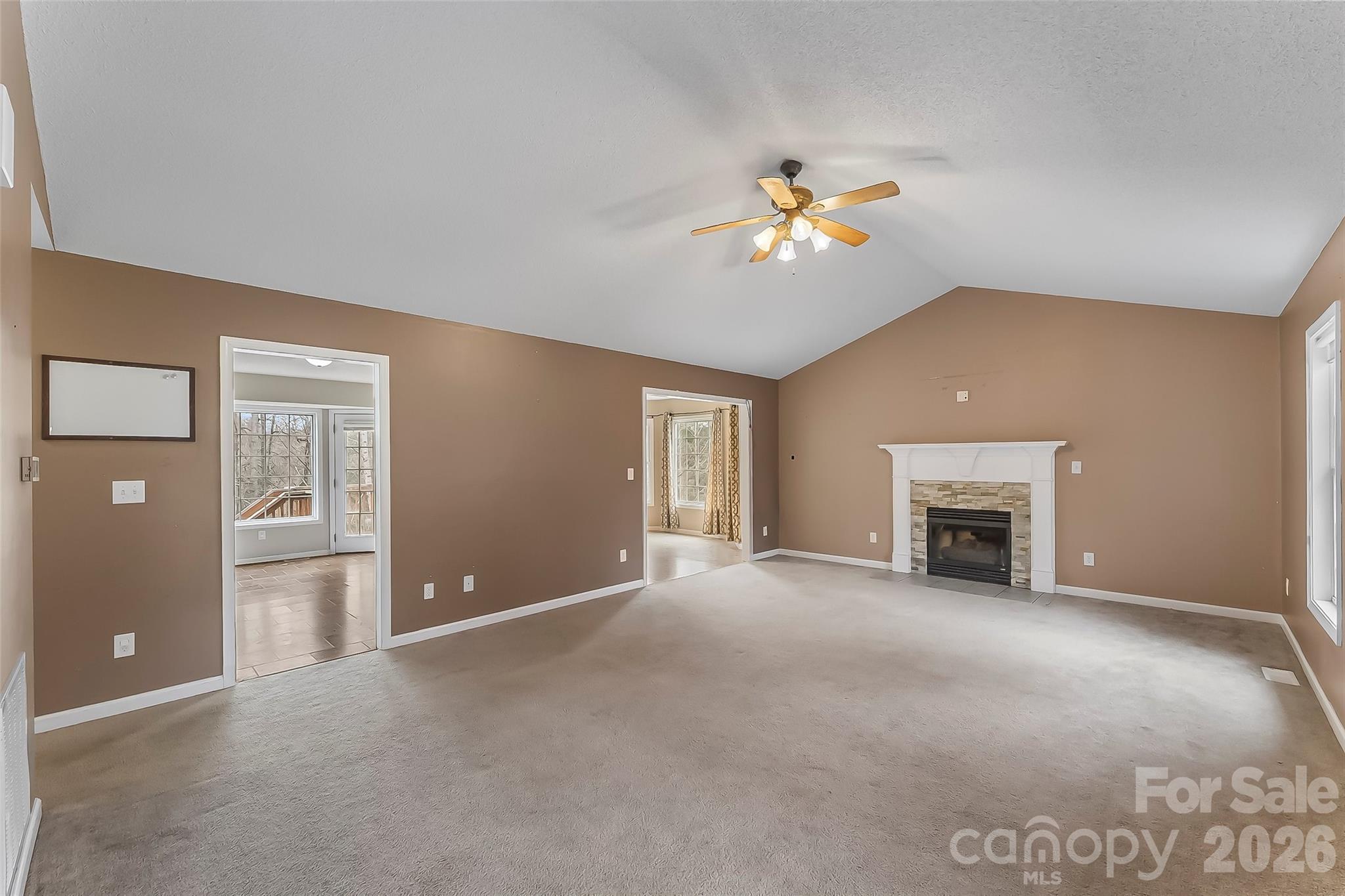 1926 Timber Trace Morganton, NC 28655 - Photo 5 of 36 a view of an empty room with a fireplace and a window