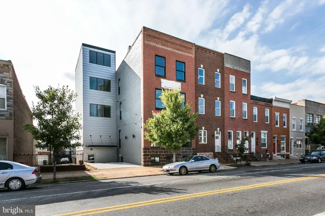 a cars parked in front of a building
