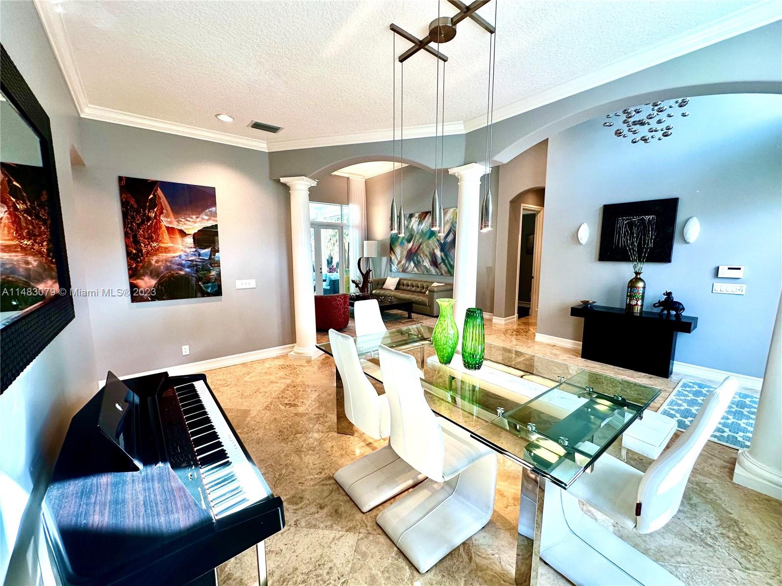 465 Northeast 2nd Street Boca Raton, FL 33432 - Photo 12 of 73 a living room with furniture and a flat screen tv