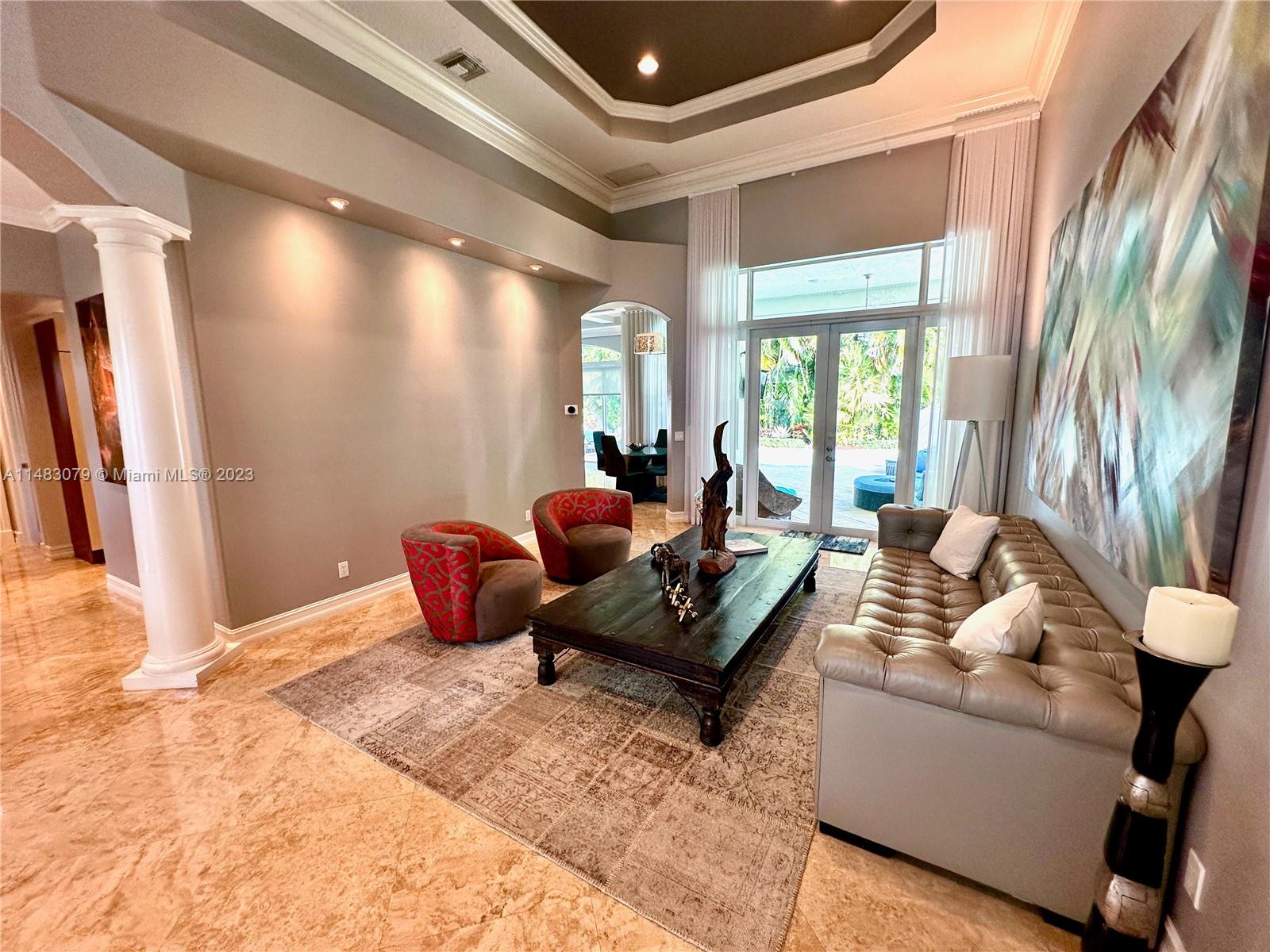 465 Northeast 2nd Street Boca Raton, FL 33432 - Photo 13 of 73 a living room with furniture and a large window