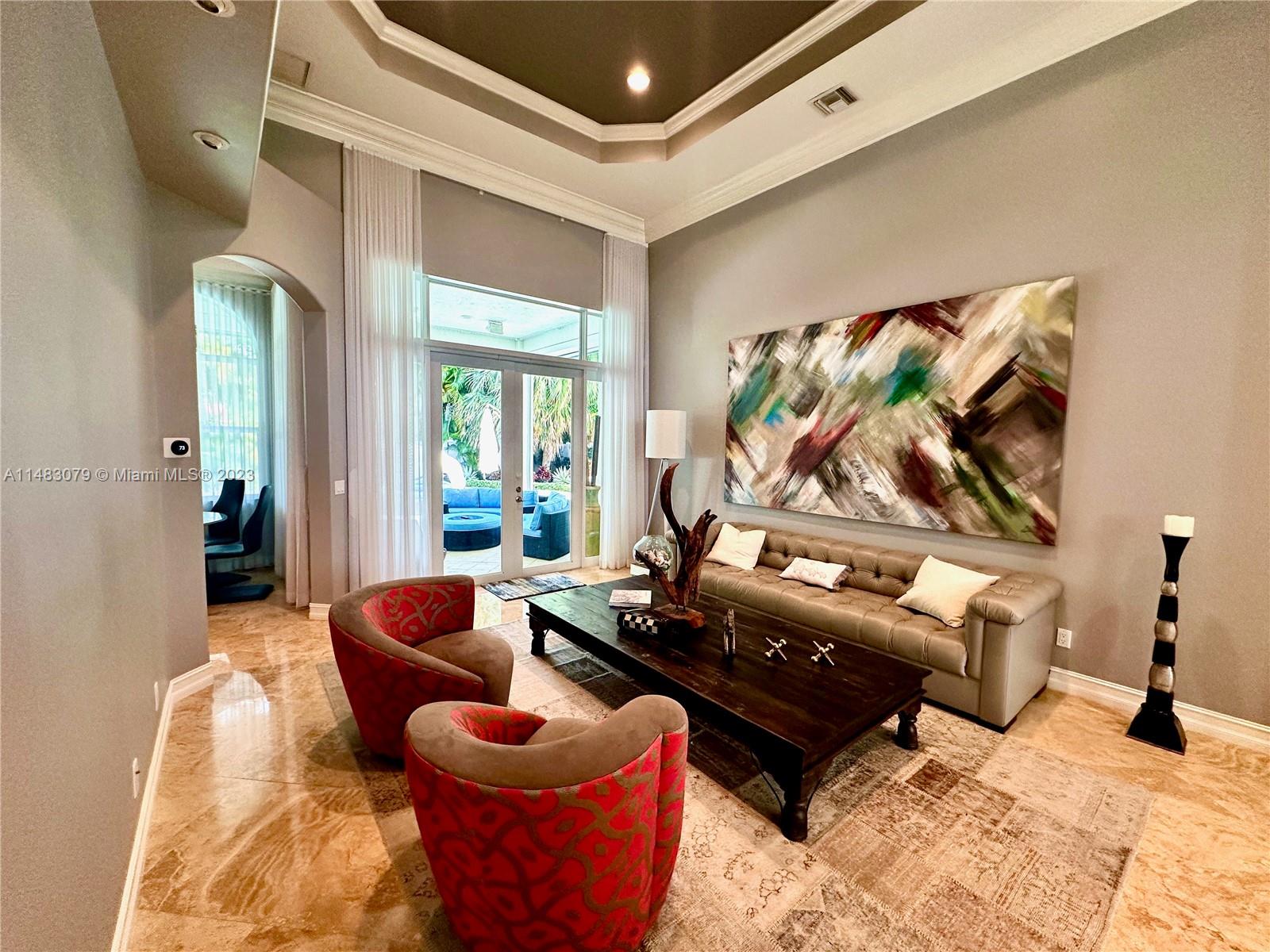 465 Northeast 2nd Street Boca Raton, FL 33432 - Photo 14 of 73 a living room with furniture and a flat screen tv
