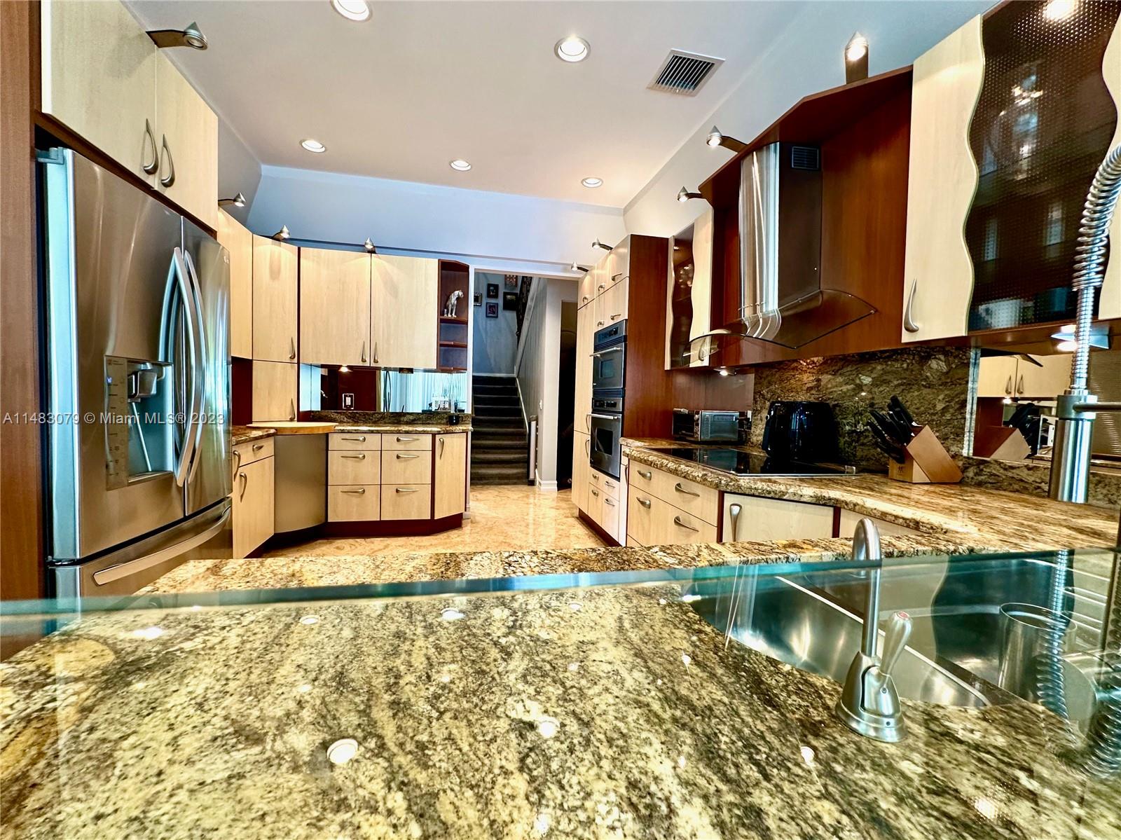 465 Northeast 2nd Street Boca Raton, FL 33432 - Photo 18 of 73 a living room with furniture a flat screen tv and a floor to ceiling window