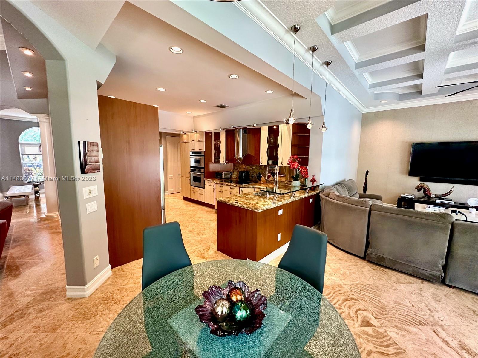 465 Northeast 2nd Street Boca Raton, FL 33432 - Photo 24 of 73 a living room with stainless steel appliances furniture and a view of kitchen