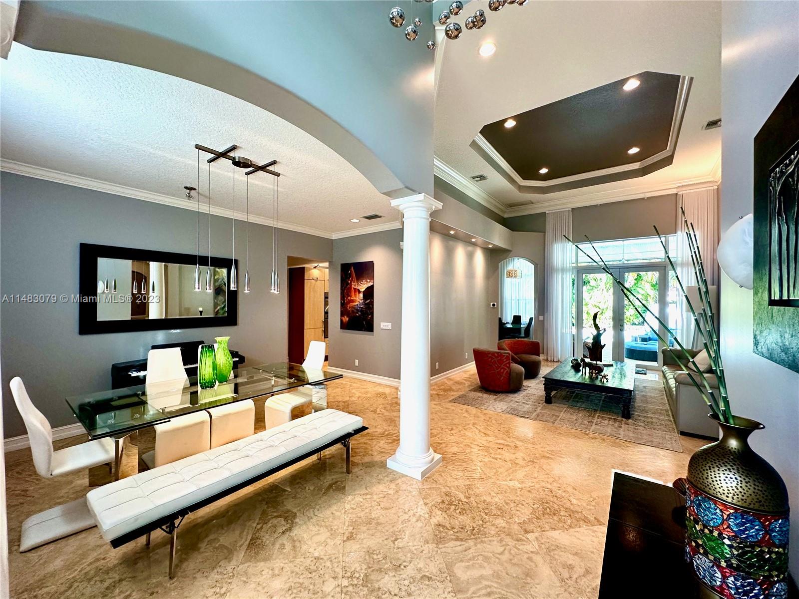 465 Northeast 2nd Street Boca Raton, FL 33432 - Photo 3 of 73 a living room with furniture and a flat screen tv