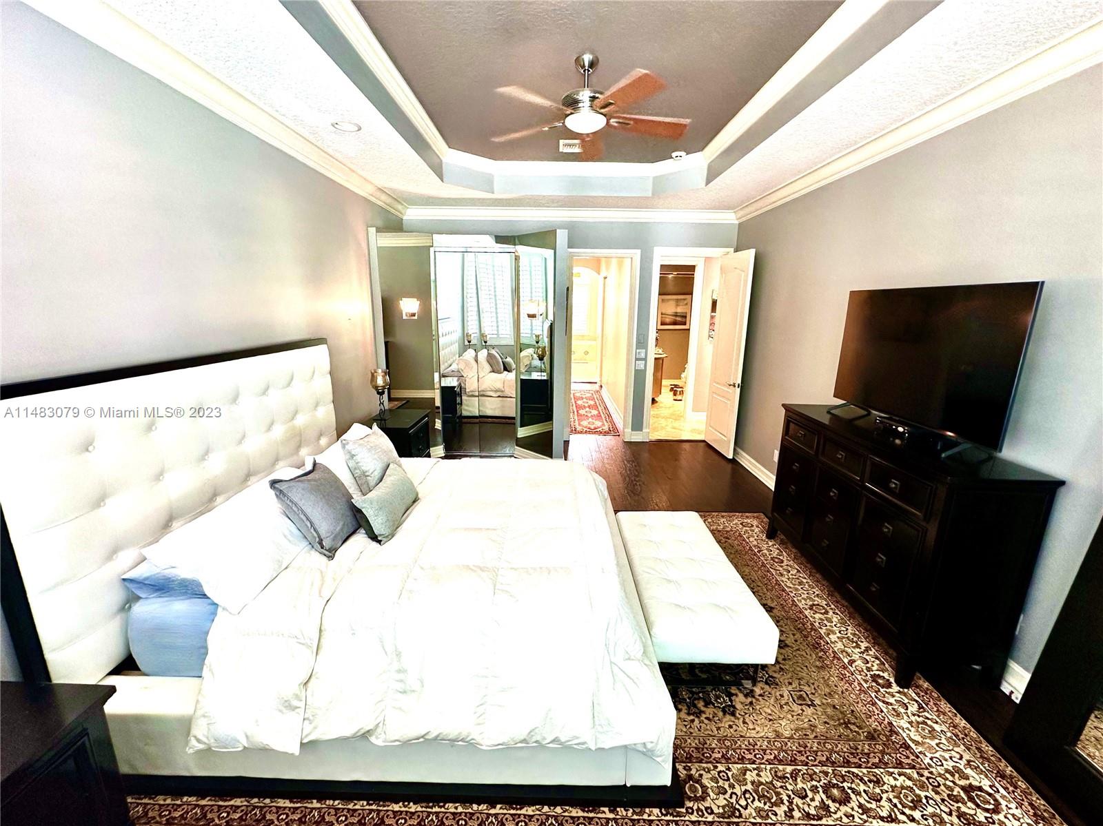 465 Northeast 2nd Street Boca Raton, FL 33432 - Photo 32 of 73 a living room with a bed and flat screen tv