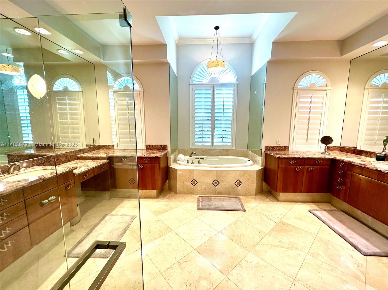 465 Northeast 2nd Street Boca Raton, FL 33432 - Photo 37 of 73 a large spacious bathroom with a large tub and sink
