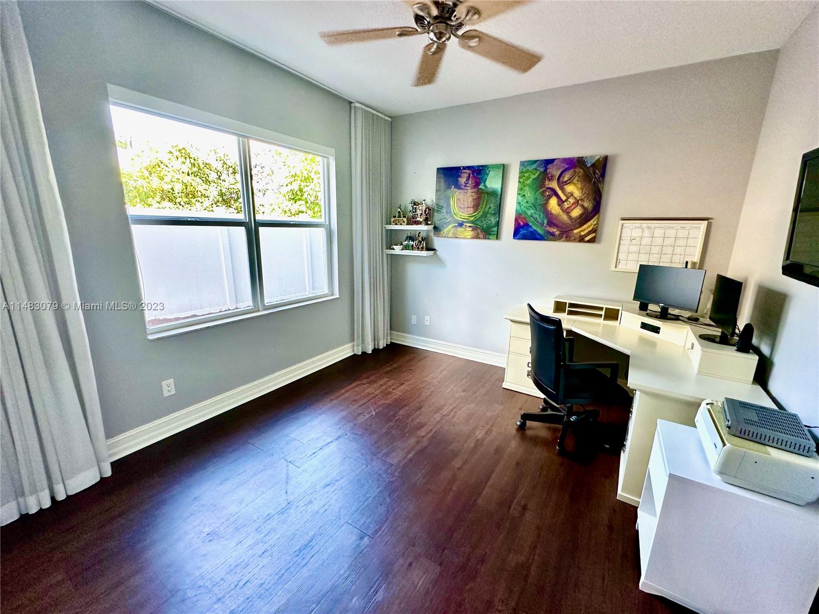 465 Northeast 2nd Street Boca Raton, FL 33432 - Photo 41 of 73 a workspace with furniture hardwood and a window