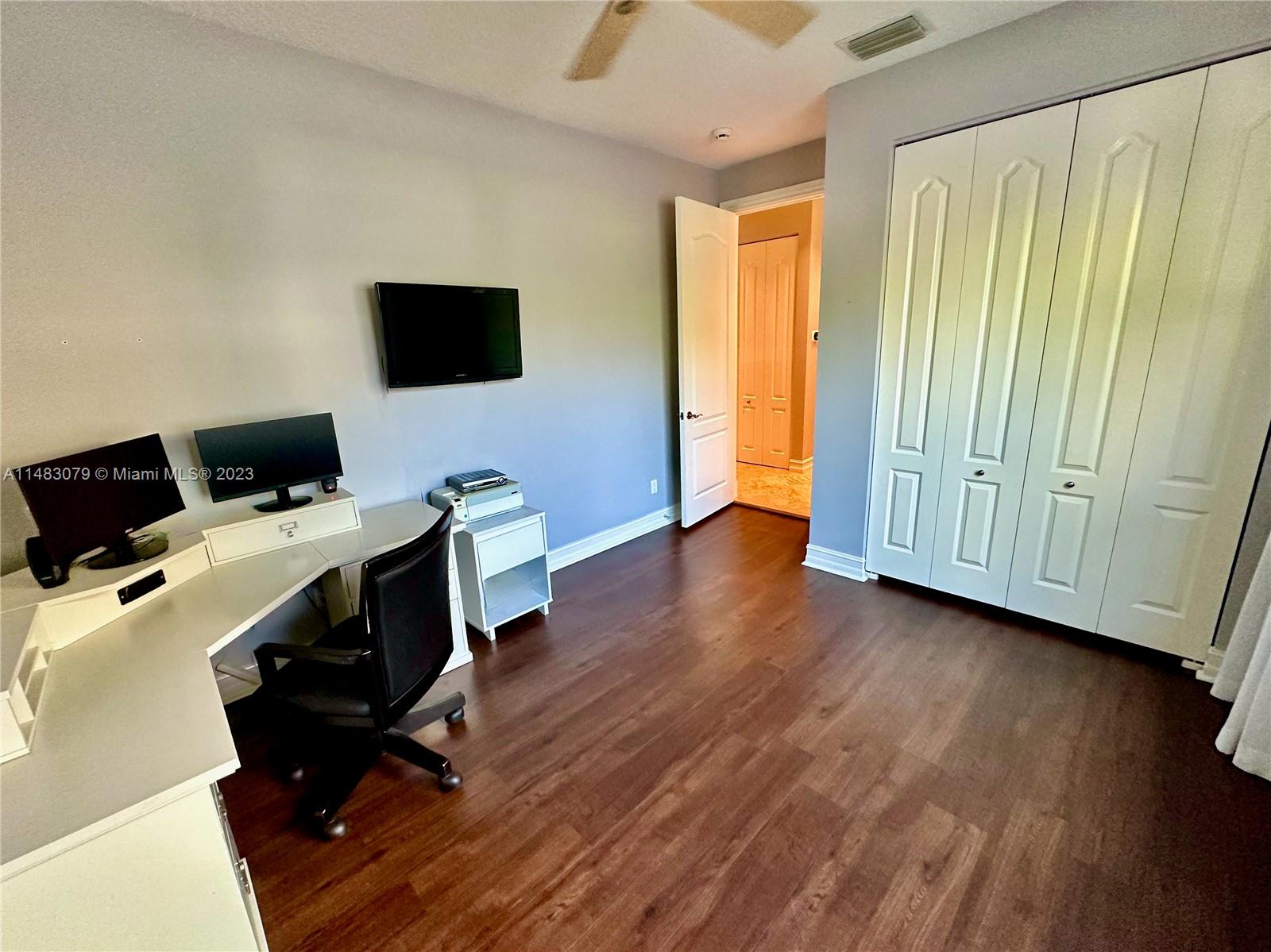 465 Northeast 2nd Street Boca Raton, FL 33432 - Photo 42 of 73 a view of workspace with wooden floor windows