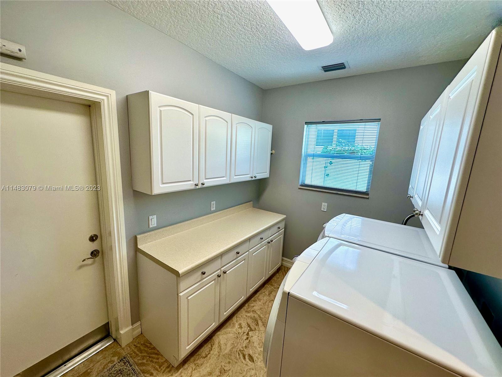 465 Northeast 2nd Street Boca Raton, FL 33432 - Photo 46 of 73 a room with storage and utility