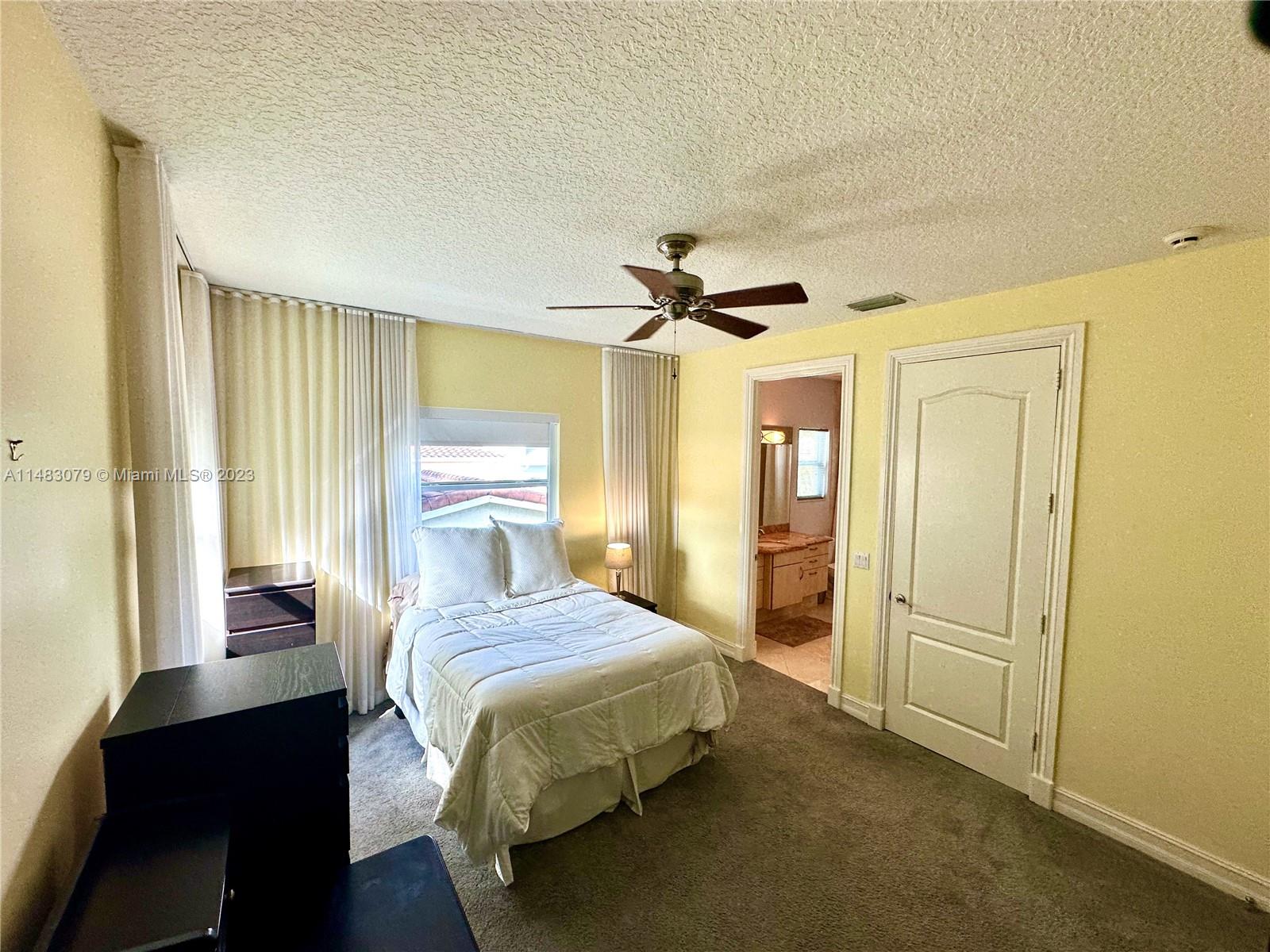 465 Northeast 2nd Street Boca Raton, FL 33432 - Photo 58 of 73 a bedroom with a bed and a mirror