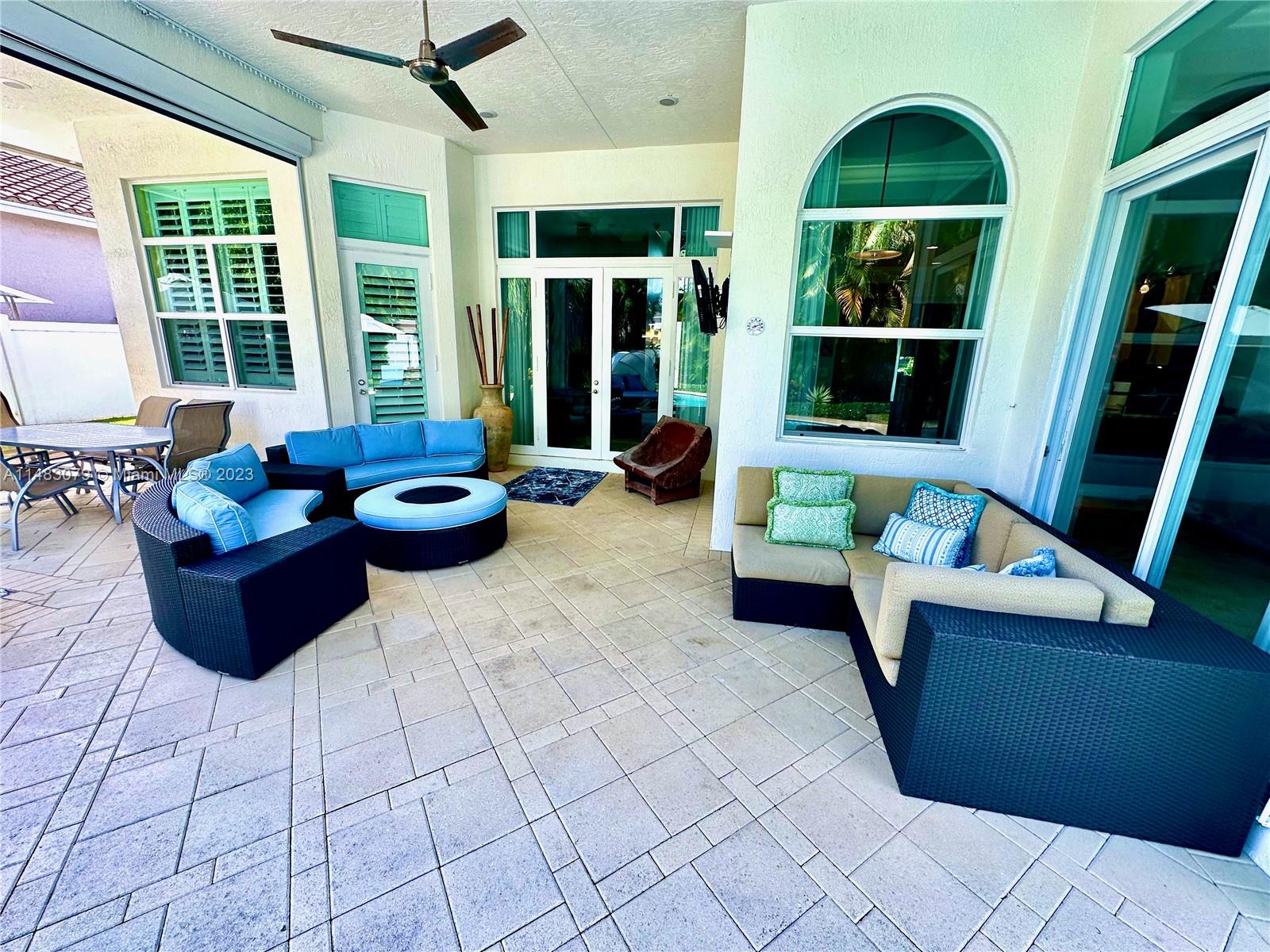 465 Northeast 2nd Street Boca Raton, FL 33432 - Photo 61 of 73 a living room with furniture and a potted plant