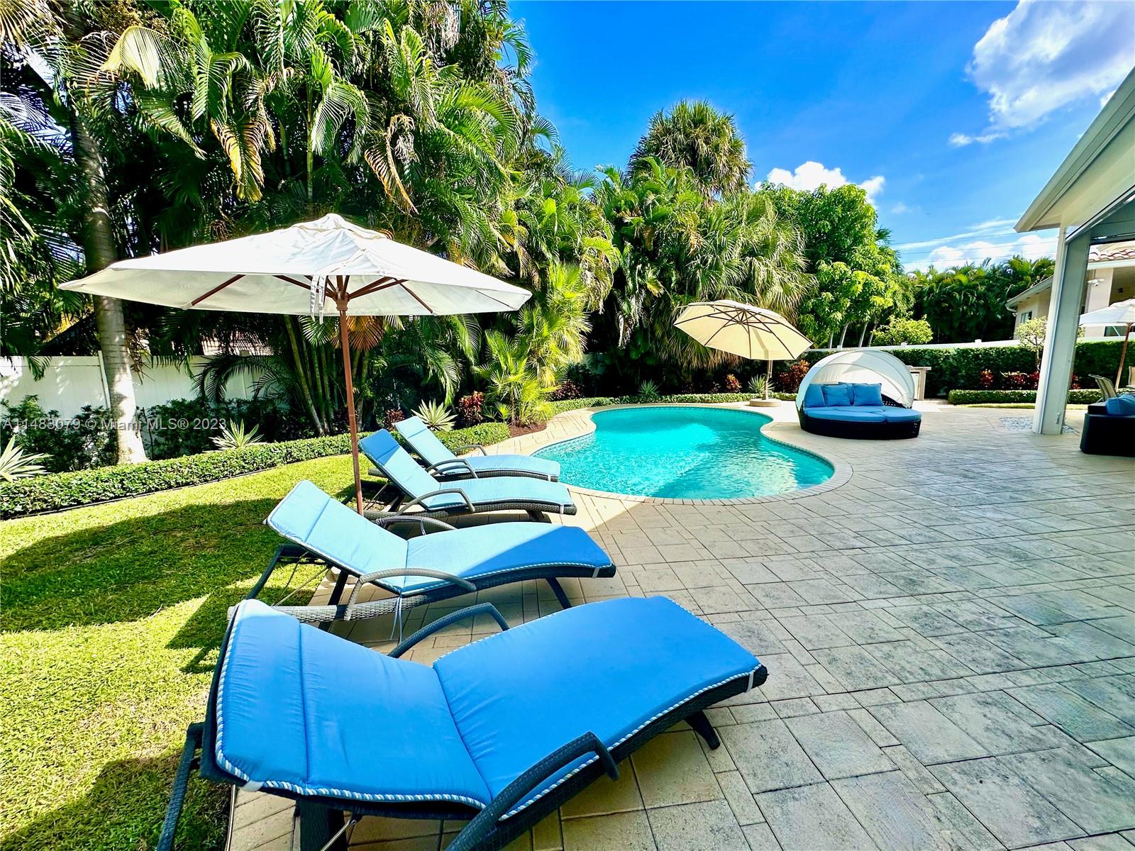 465 Northeast 2nd Street Boca Raton, FL 33432 - Photo 69 of 73 a view of a yard with furniture and a garden