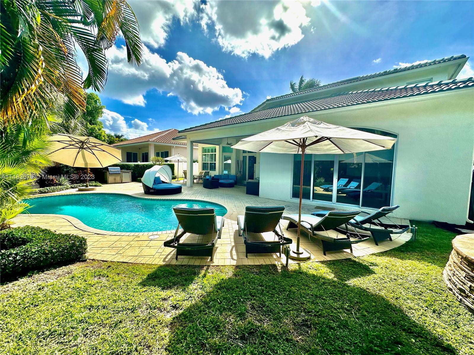 465 Northeast 2nd Street Boca Raton, FL 33432 - Photo 71 of 73 a view of a house with backyard porch and sitting area