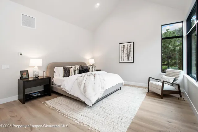 a large bedroom with a bed