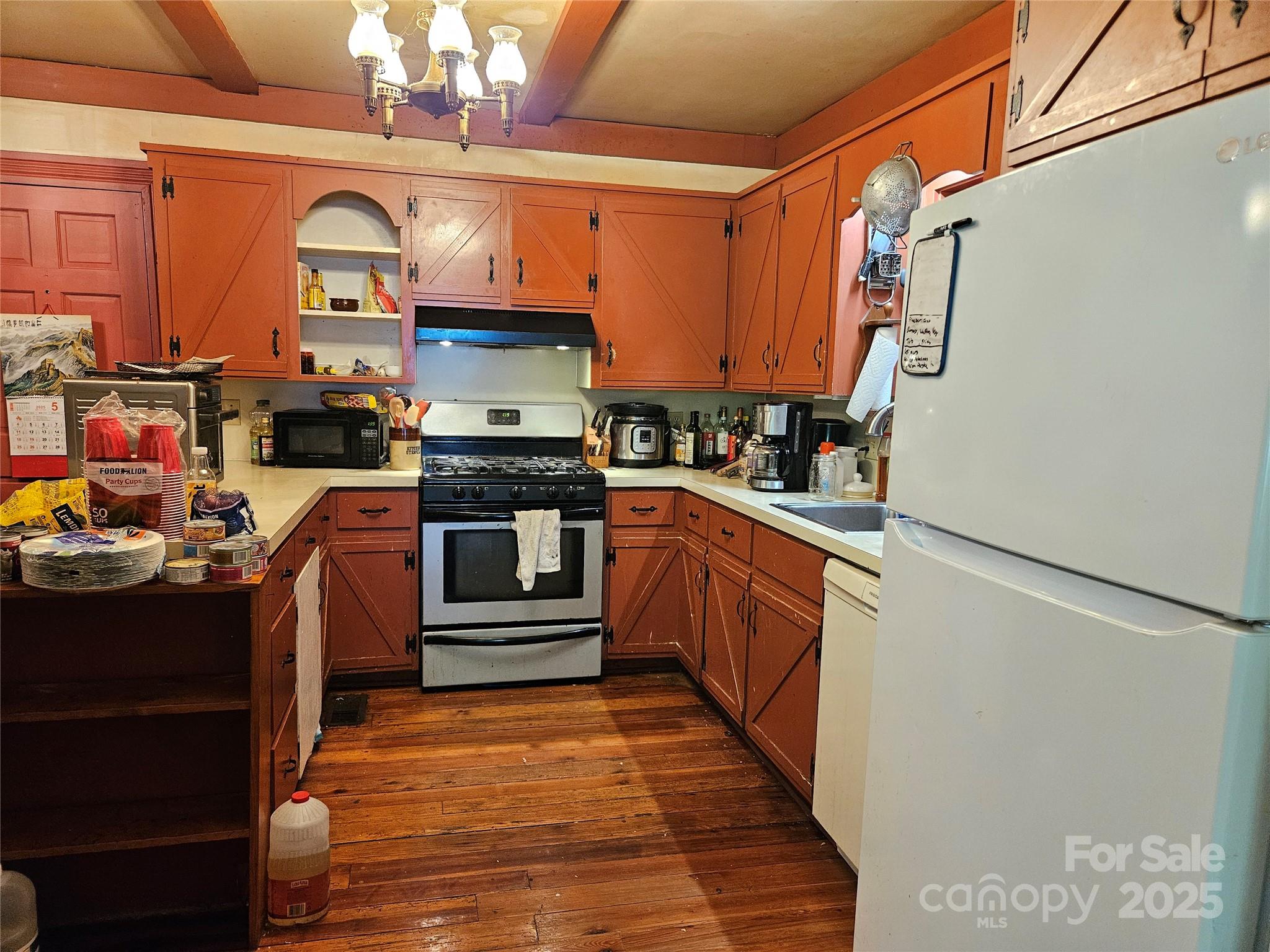 368 Settlemyre Road Morganton, NC 28655 - Photo 16 of 47 a kitchen with stainless steel appliances granite countertop a stove a sink dishwasher and a refrigerator